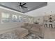 Living room features open concept to kitchen and stylish decor at 5755 Woodland Sage Dr, Sarasota, FL 34238