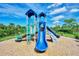 Modern playground with a large slide and climbing structures at 5755 Woodland Sage Dr, Sarasota, FL 34238