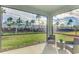 Relaxing screened porch overlooks backyard with seating at 5755 Woodland Sage Dr, Sarasota, FL 34238