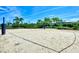 Community volleyball court with sand and net at 5755 Woodland Sage Dr, Sarasota, FL 34238