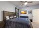 Bedroom with a king-size bed and large TV at 5817 Hevena Ct, Palmetto, FL 34221