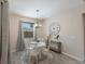 A well-lit breakfast nook features a round table and chairs, perfect for morning meals at 5817 Hevena Ct, Palmetto, FL 34221