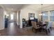 Elegant dining room featuring a dark wood table and neutral decor at 5817 Hevena Ct, Palmetto, FL 34221
