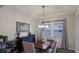 Charming dining room with a chandelier and built-in cabinetry at 5817 Hevena Ct, Palmetto, FL 34221