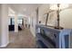 Neutral-toned hallway with contemporary console table at 5817 Hevena Ct, Palmetto, FL 34221