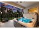 Enjoy a luxurious hot tub on this screened patio at 5817 Hevena Ct, Palmetto, FL 34221
