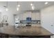 Island kitchen with granite countertops and stainless steel appliances at 5817 Hevena Ct, Palmetto, FL 34221