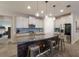 Spacious kitchen with large island, granite countertops, and stainless steel appliances at 5817 Hevena Ct, Palmetto, FL 34221
