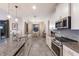 Open concept kitchen with stainless steel appliances and granite countertops at 5817 Hevena Ct, Palmetto, FL 34221
