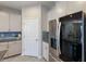 Kitchen with stainless steel refrigerator and pantry at 5817 Hevena Ct, Palmetto, FL 34221