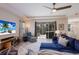 Spacious living room with comfortable seating and sliding doors to lanai at 5817 Hevena Ct, Palmetto, FL 34221