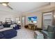 Comfortable living room with sectional sofa and large TV at 5817 Hevena Ct, Palmetto, FL 34221
