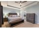Main bedroom suite includes a king bed, dresser, and ensuite bathroom at 5817 Hevena Ct, Palmetto, FL 34221