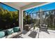 Spacious screened lanai with comfortable seating at 5817 Hevena Ct, Palmetto, FL 34221