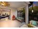 Covered patio with comfortable seating and view into living room at 5817 Hevena Ct, Palmetto, FL 34221