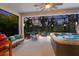 Relaxing screened patio with hot tub and comfortable seating at 5817 Hevena Ct, Palmetto, FL 34221