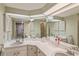 Double vanity bathroom with large mirror and shower at 610 Estuary Dr # 610, Bradenton, FL 34209