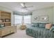 Bedroom with daybed, shelving, and ceiling fan at 610 Estuary Dr # 610, Bradenton, FL 34209