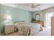Spacious bedroom with ceiling fan and floral bedding at 610 Estuary Dr # 610, Bradenton, FL 34209