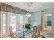 Dining area with glass-top table and access to patio at 610 Estuary Dr # 610, Bradenton, FL 34209