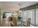 Dining area with glass table and chairs, view to living room at 610 Estuary Dr # 610, Bradenton, FL 34209