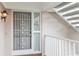 Building entry with white railing and security door at 610 Estuary Dr # 610, Bradenton, FL 34209