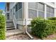 Exterior view showing building entrance, stairs, and landscaping at 610 Estuary Dr # 610, Bradenton, FL 34209