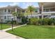 Two-story condo building with manicured lawn and walkway at 610 Estuary Dr # 610, Bradenton, FL 34209