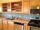 Simple kitchen with light wood cabinets at 610 Estuary Dr # 610, Bradenton, FL 34209
