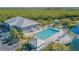 Community pool with clubhouse and surrounding deck at 610 Estuary Dr # 610, Bradenton, FL 34209