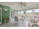 Bright sunroom with seating and outdoor views at 610 Estuary Dr # 610, Bradenton, FL 34209