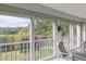 Sunroom features sliding doors and tranquil view at 610 Estuary Dr # 610, Bradenton, FL 34209