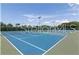 Community tennis court with blue surface at 610 Estuary Dr # 610, Bradenton, FL 34209