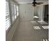 Sunlit dining room with tile flooring and plantation shutters at 618 Jungle Queen Way, Longboat Key, FL 34228