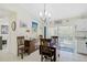 Dining area with wooden table and access to backyard at 6697 Beckwith Ave, North Port, FL 34291