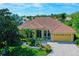 Aerial view of a beautiful home in a lush, well-maintained community at 7596 Palmer Glen Cir, Sarasota, FL 34240