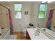 Bathroom with tub shower combo and colorful decor at 7596 Palmer Glen Cir, Sarasota, FL 34240