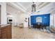 Spacious dining area with stylish chandelier and blue accent wall at 7596 Palmer Glen Cir, Sarasota, FL 34240