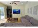 Spacious Gathering room with comfortable sectional sofa and large TV at 7596 Palmer Glen Cir, Sarasota, FL 34240