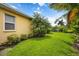 House exterior showcasing a well-maintained lawn and lush landscaping at 7596 Palmer Glen Cir, Sarasota, FL 34240
