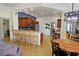 Bright kitchen features granite countertops, ample cabinetry, and an island with seating at 7596 Palmer Glen Cir, Sarasota, FL 34240