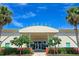 Exterior view of a community library building with palm trees and landscaping at 7596 Palmer Glen Cir, Sarasota, FL 34240