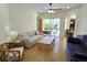 Spacious living area featuring ample natural light and comfy seating at 7596 Palmer Glen Cir, Sarasota, FL 34240