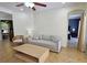 Cozy living room features a comfortable sofa and a large window at 7596 Palmer Glen Cir, Sarasota, FL 34240