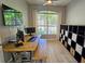 Home office with built-in shelving and large window at 7596 Palmer Glen Cir, Sarasota, FL 34240