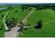 Vast green park with walking trails and palm trees at 7596 Palmer Glen Cir, Sarasota, FL 34240