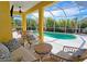 Enjoy this refreshing pool with a screened patio and comfortable seating area at 7596 Palmer Glen Cir, Sarasota, FL 34240