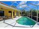 Enjoy this relaxing pool with screened enclosure and plenty of surrounding patio space at 7596 Palmer Glen Cir, Sarasota, FL 34240