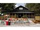 Exterior view of a rustic restaurant with outdoor seating and fire pit at 7596 Palmer Glen Cir, Sarasota, FL 34240