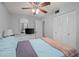 Bedroom with light blue bedding and ceiling fan at 8142 Coco Solo Ave, North Port, FL 34287